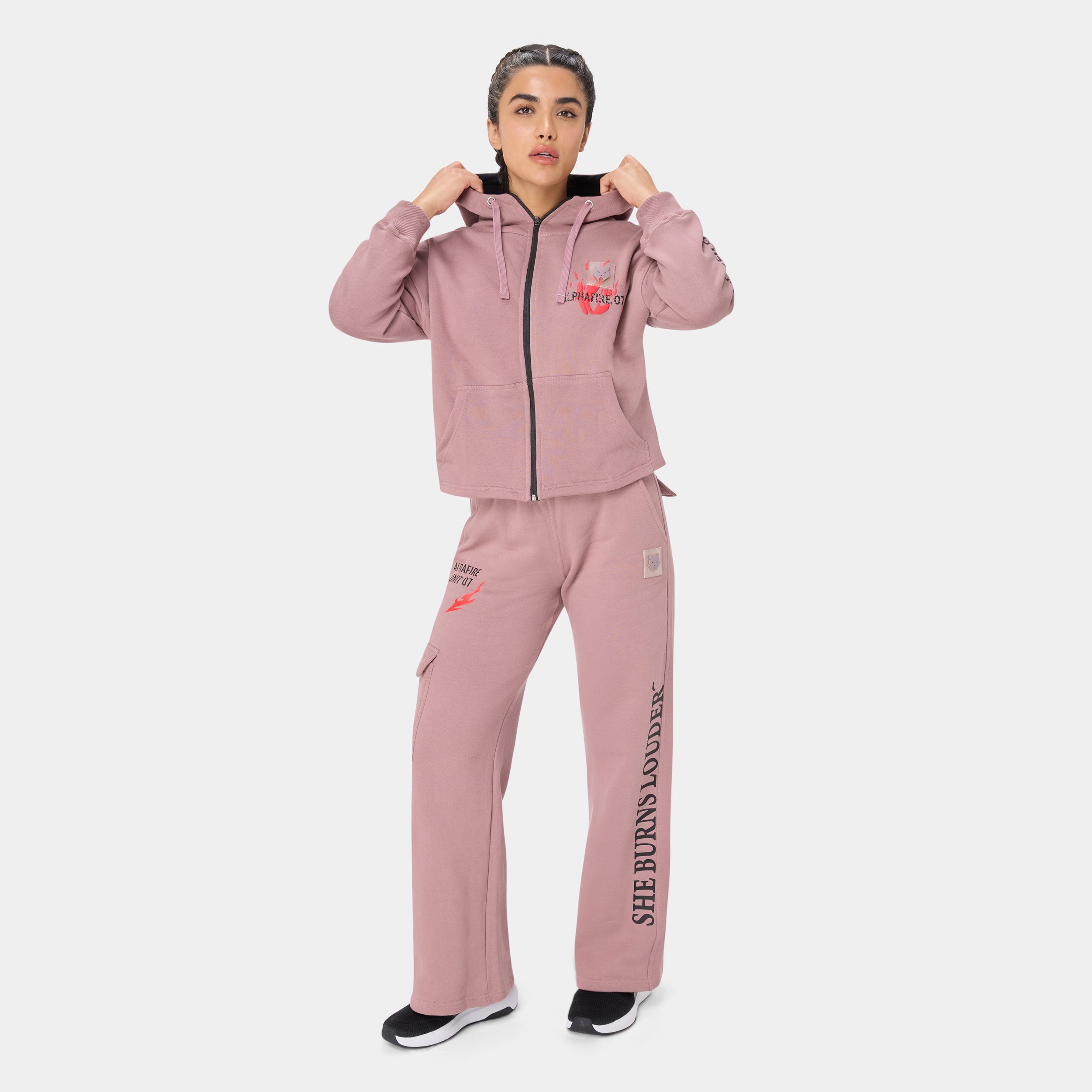 ALPHAFIRE BOTTOM — STORM ROSE — Full-body front standing, pink zip hoodie with chest graphic and cargo pants with
