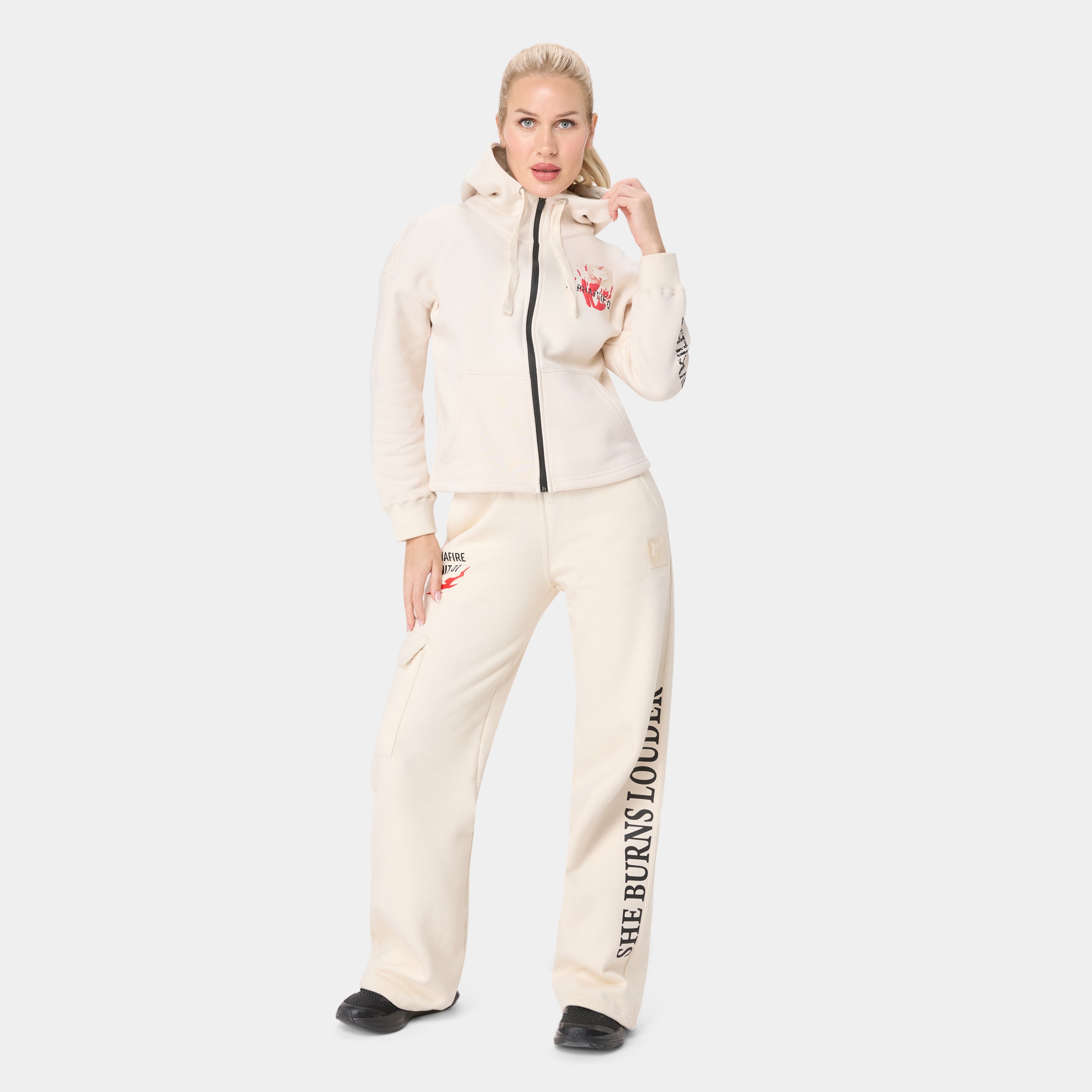ALPHAFIRE BOTTOM — TACTICAL BEIGE — Front standing view full body, cream tracksuit with cropped zip hoodie and fire/skull