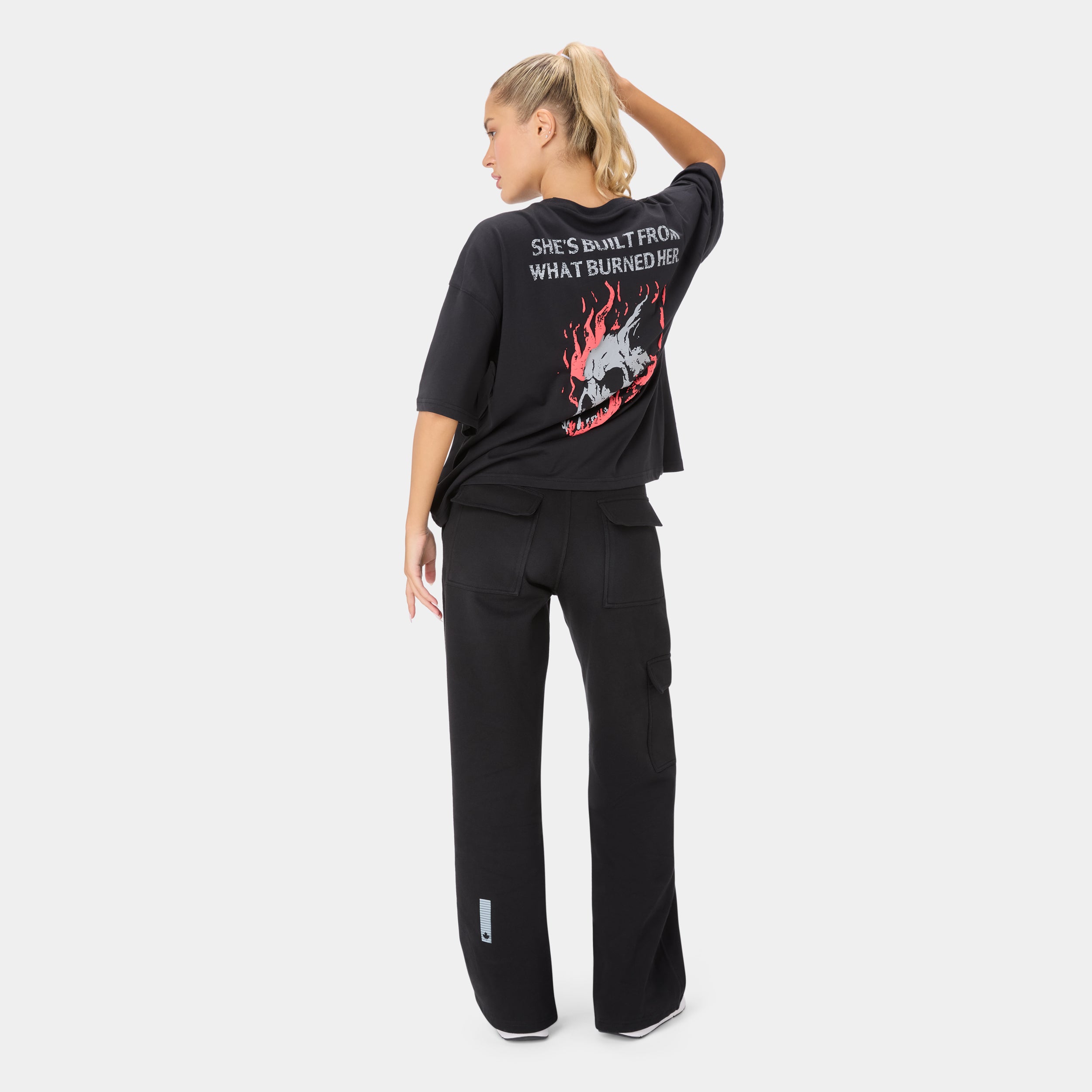 ALPHAFIRE OVERSIZED T-SHIRT — WAR BLACK — Full-body back view, black oversized tee with skull/flames back print and black ...