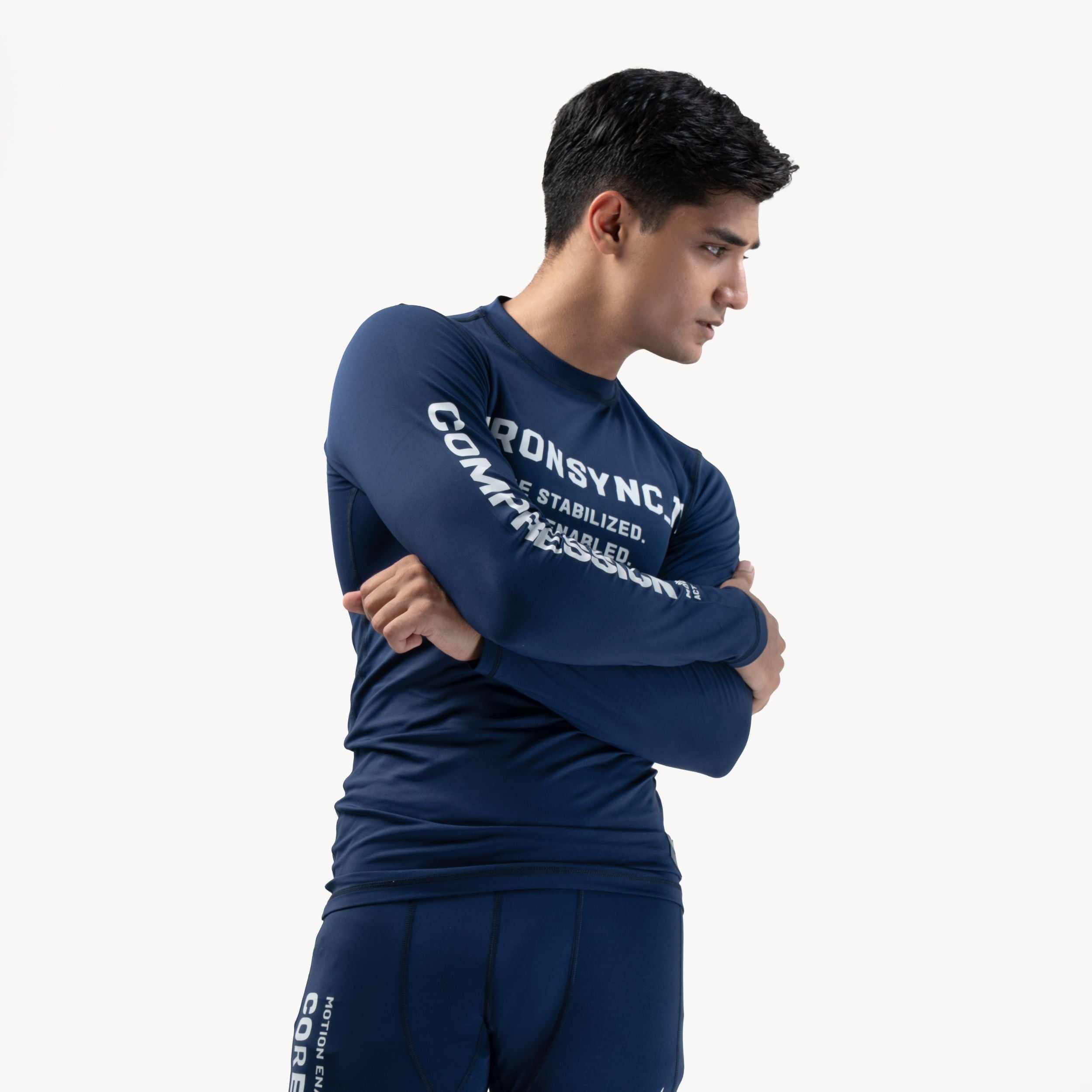 Ironsync_11 - Shadow Navy — ¾ side angle with arms crossed, COMPRESSION sleeve print visible