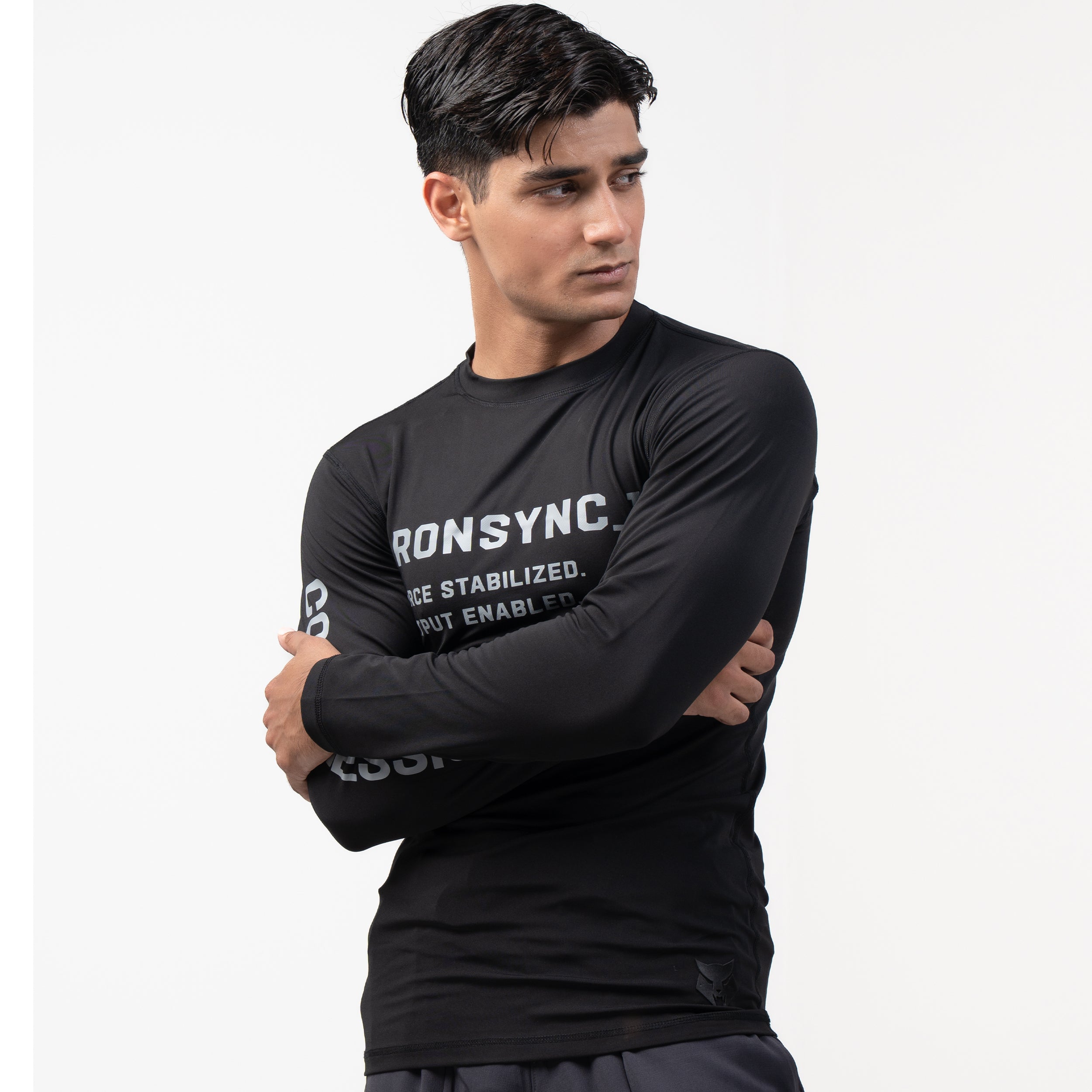 Ironsync_11 - war black — ¾ angle arms crossed, black compression top with COMPRESSION sleeve print and wrist logo