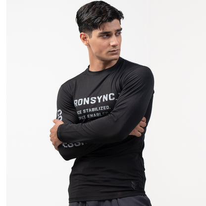 Ironsync_11 - war black — ¾ angle arms crossed, black compression top with COMPRESSION sleeve print and wrist logo
