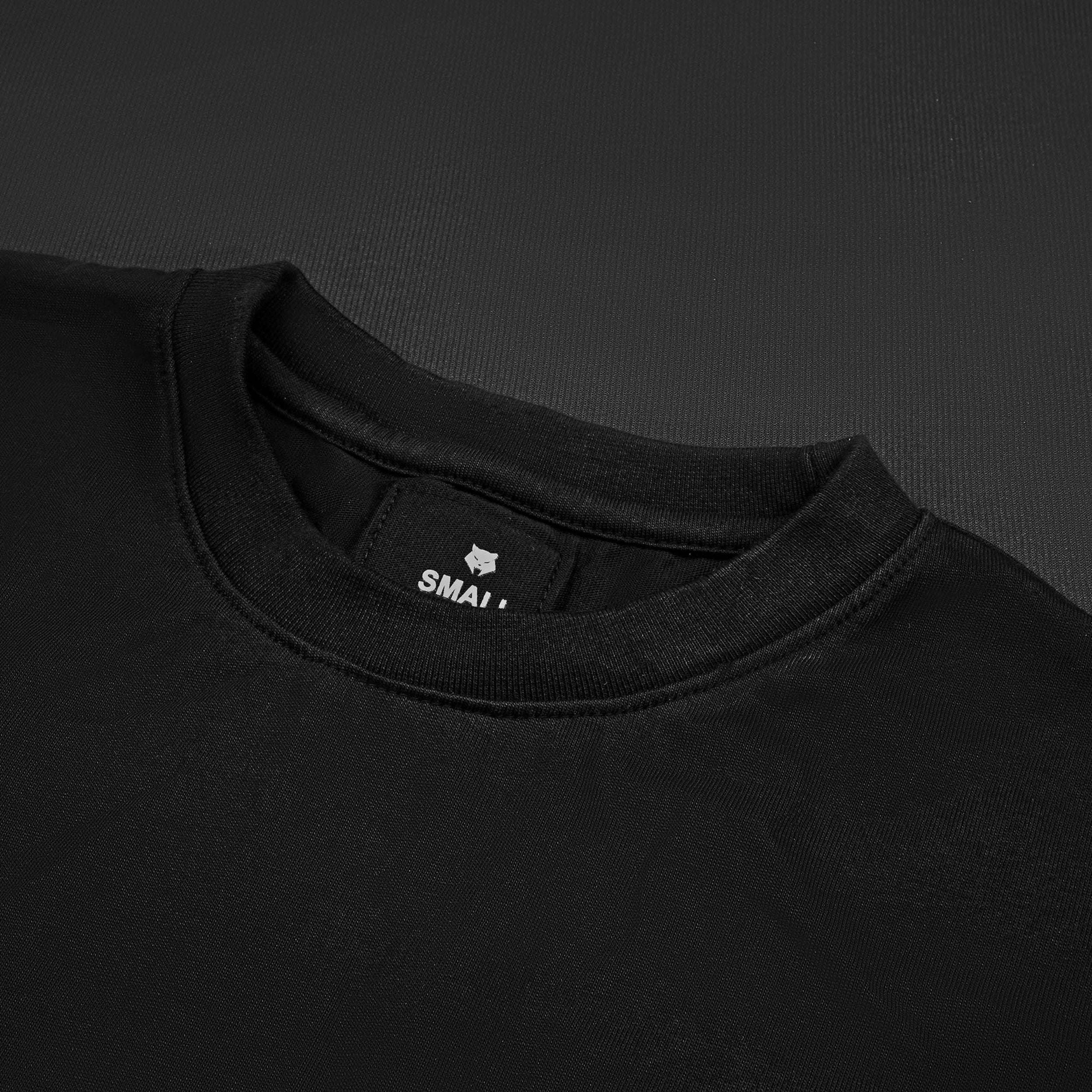 OPERATOR_77 OVERSIZED TEE — WAR BLACK — Flat-lay close-up, black tee inner neck label showing wolf logo and size tag